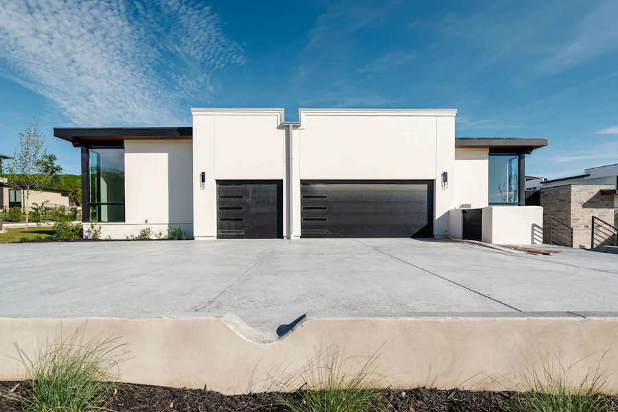 Home exterior with clean siding and driveway